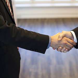 reputable trusts lawyer suit and tie shaking hands